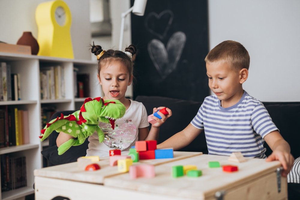 two children playing with toys in an orthodontist office