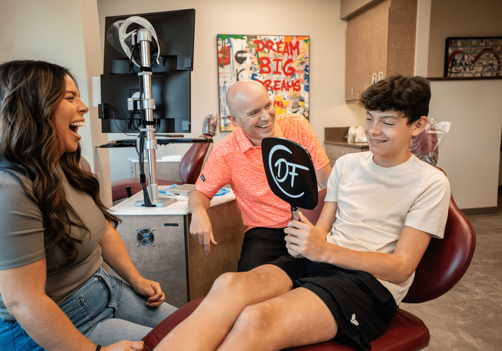 Smiling patient wearing metal braces during orthodontic treatment in Fresno, California